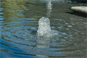 This design uses a large pool with jets to create a formal, contemporary water feature.