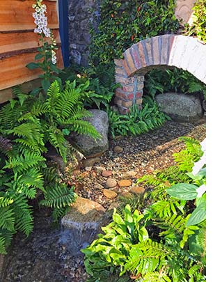 Light filled stream in this Dublin water garden design.