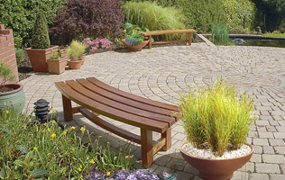 Large contemporary water feature with bridges was an element of this Dublin garden design.